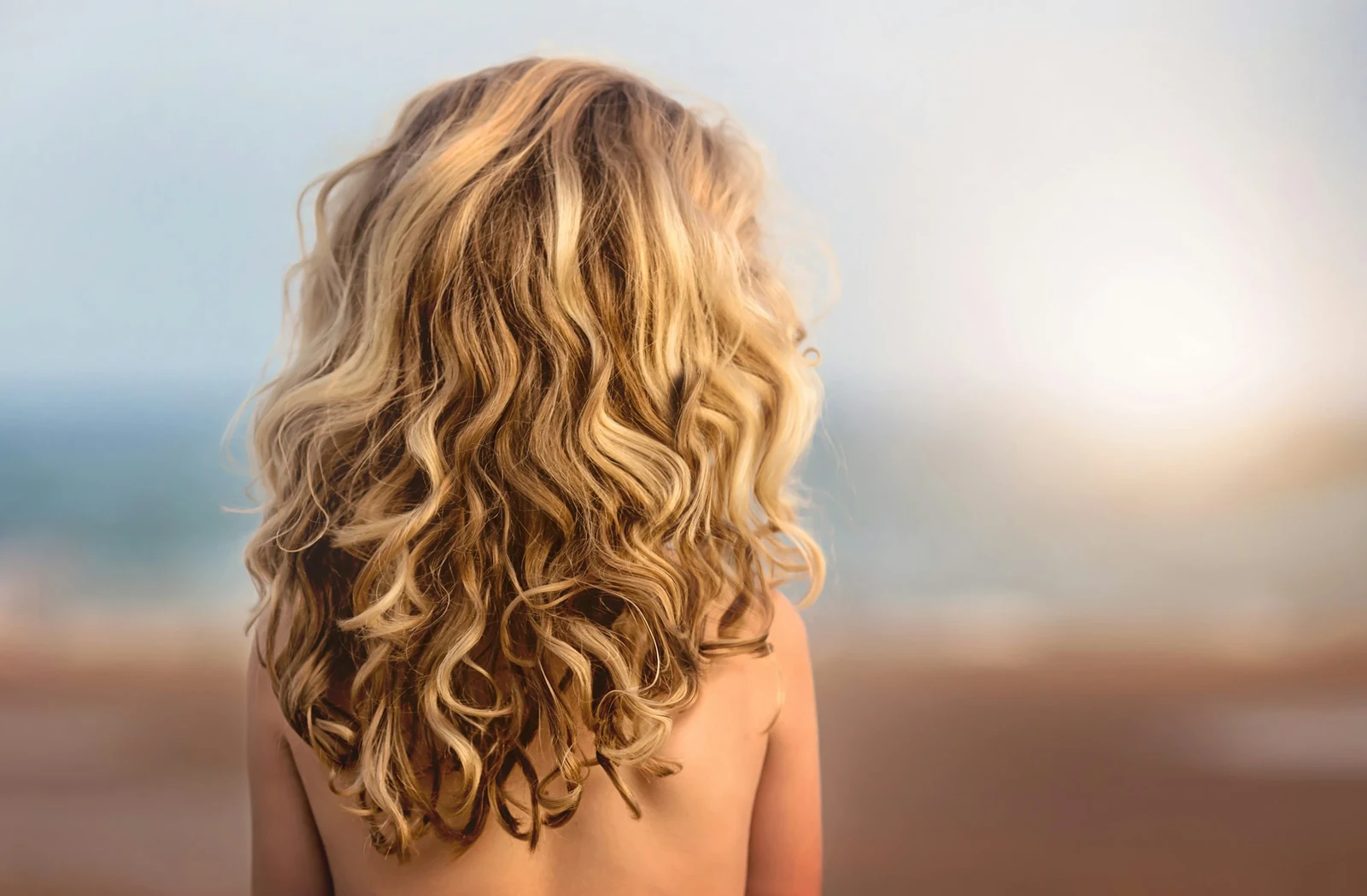 Golden curls with natural highlights